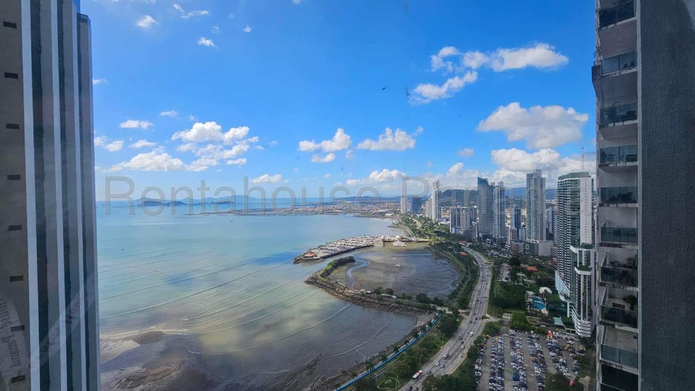 Aerial view of Panama City coastline and BICSA Tower waterfront skyscraper