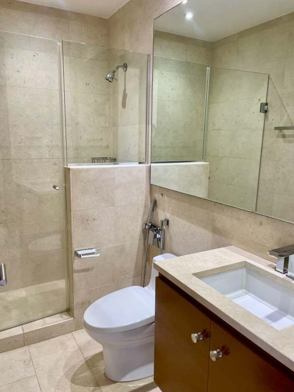 Bright living room with marble flooring and balcony facing golf PH Greenview Panama