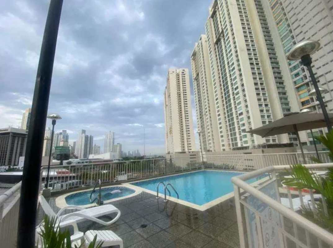 Covered balcony with view of pool and skyline PH San Francisco Bay Panama