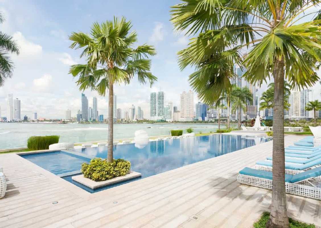 Modern lobby glass walls and panoramic waterfront views PH The Point Panama