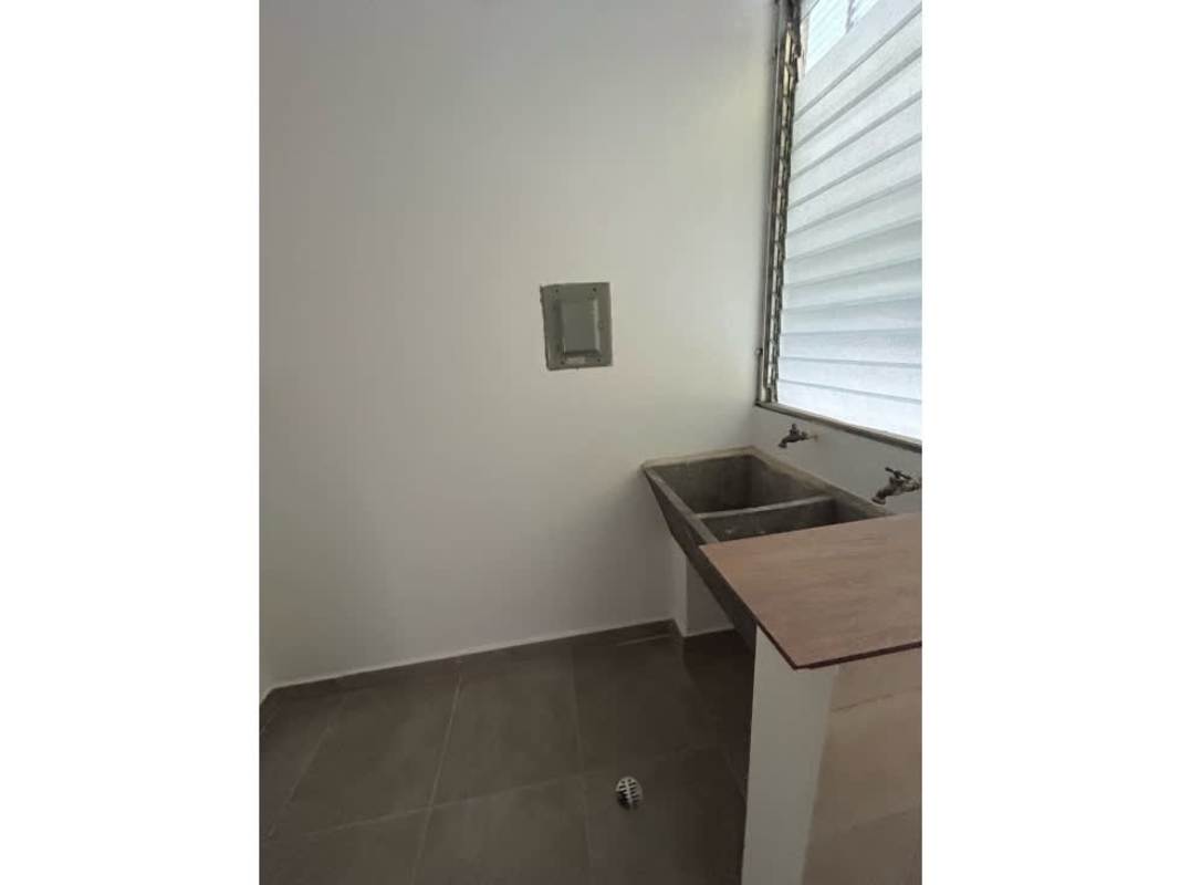 Laundry space with utility sink granite countertop and window with louvers PH Mystic Park Juan Díaz Panama
