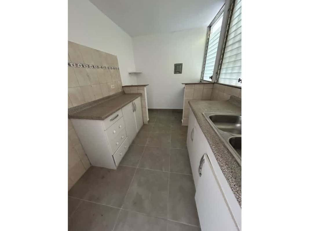 Open modern kitchen with granite countertop large louvered windows and tiled backsplash PH Mystic Park Juan Díaz Panama