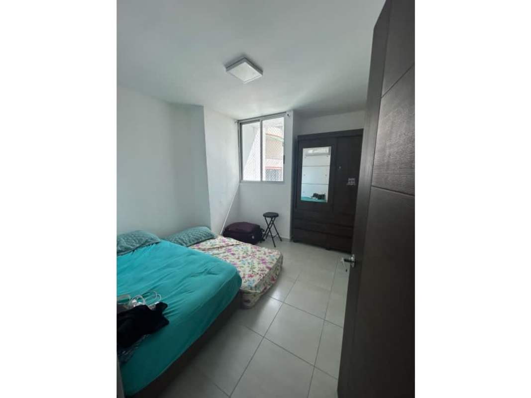 Bedroom with large window, wardrobe, ceramic tiles offering city views at PH Altavista Tower Panama City
