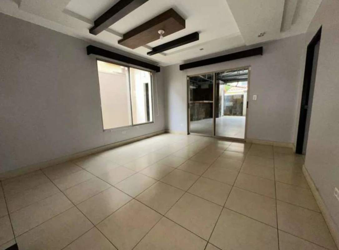 Private balcony with wrought iron railing overlooking palms in Paseo Dorado Ancón Panama City