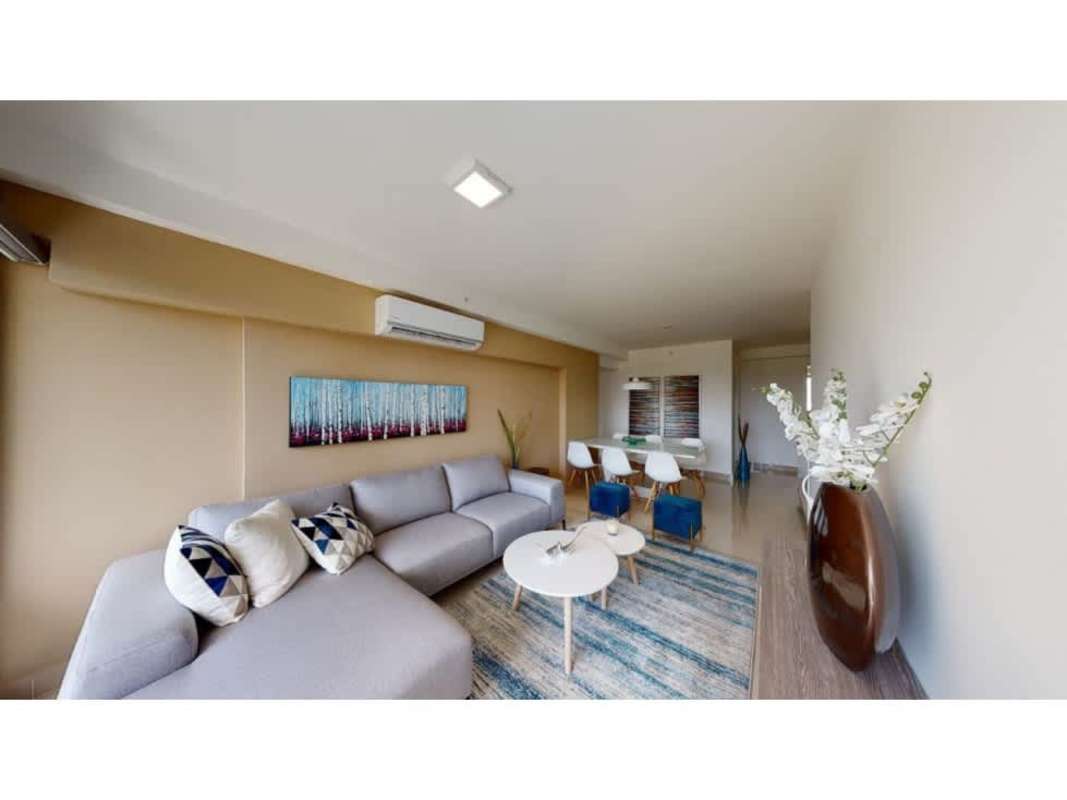 Bedroom with large windows, roller blinds, city views at PH Residencias del Sol San Francisco Panama