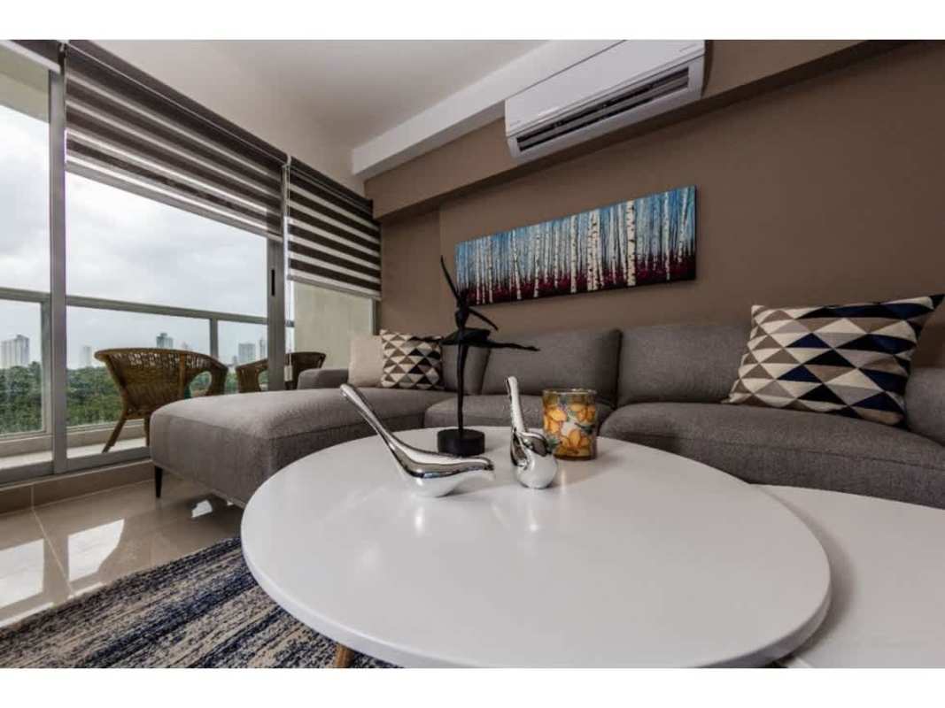 Spacious living room connected to balcony with skyline view at PH Residencias del Sol Panama City
