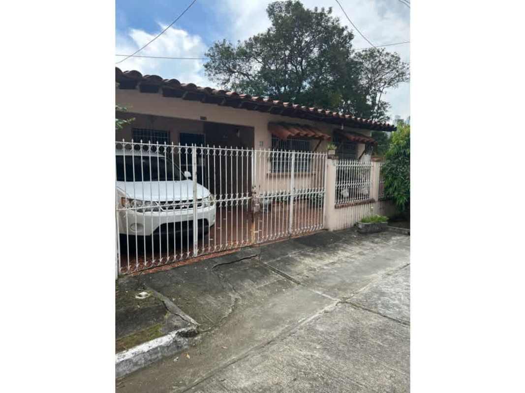 Interior dining and living room with wood beams and chandeliers Chanis house for sale