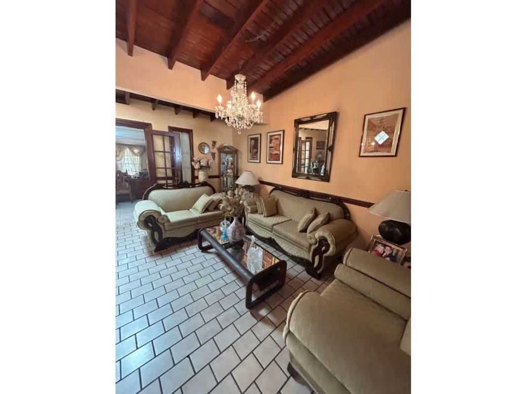 Living room with exposed wooden beams and classic design Chanis house for sale