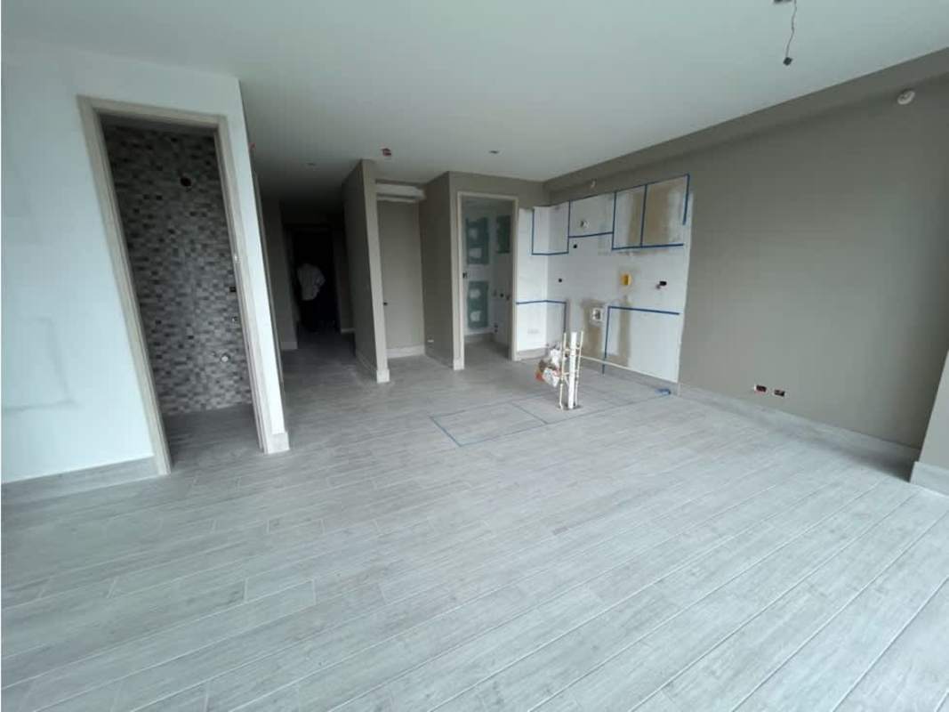 Bathroom with mosaic tile shower wall and glass door in PH Azurre Panama City