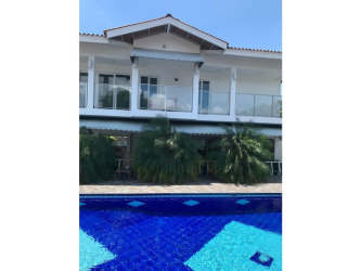 Spacious covered terrace with hammock, seating area at luxury beach villa in Nueva Gorgona Panama