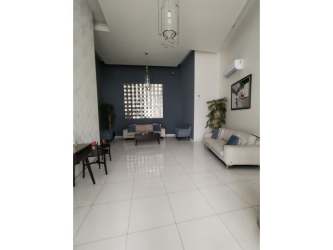 Modern minimalist living room with high ceiling, large window at PH Metropolitan Park Panama