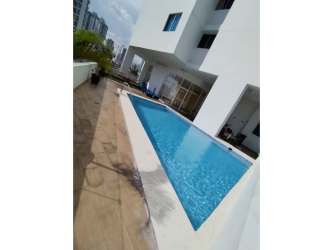 Modern building swimming pool area with lounge zone in PH Metropolitan Park Panama City