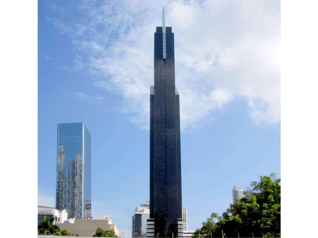 Multiple high-rise skyscrapers with modern designs in Panama City's business district and ocean views