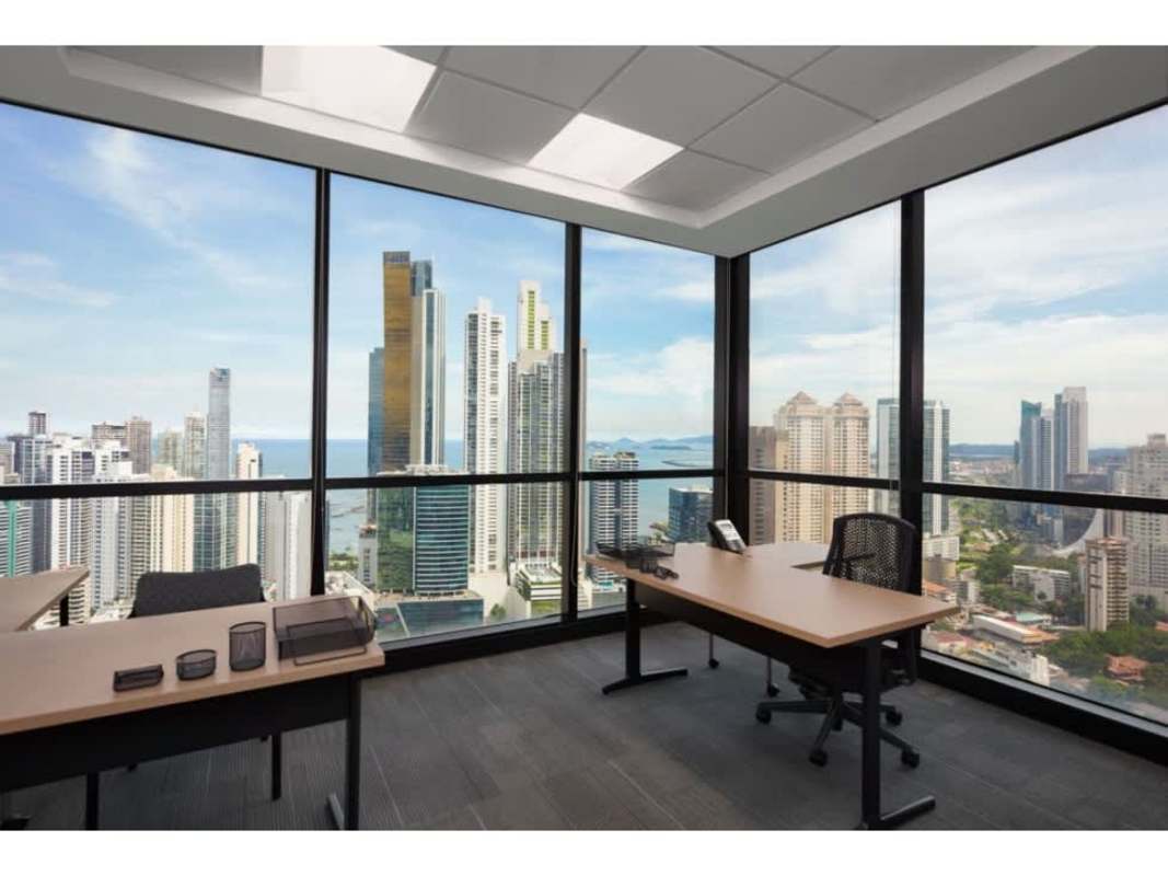 Tall glass facade of PH BICSA Financial Center skyscraper with modern entrance at Calle 50 Panama City