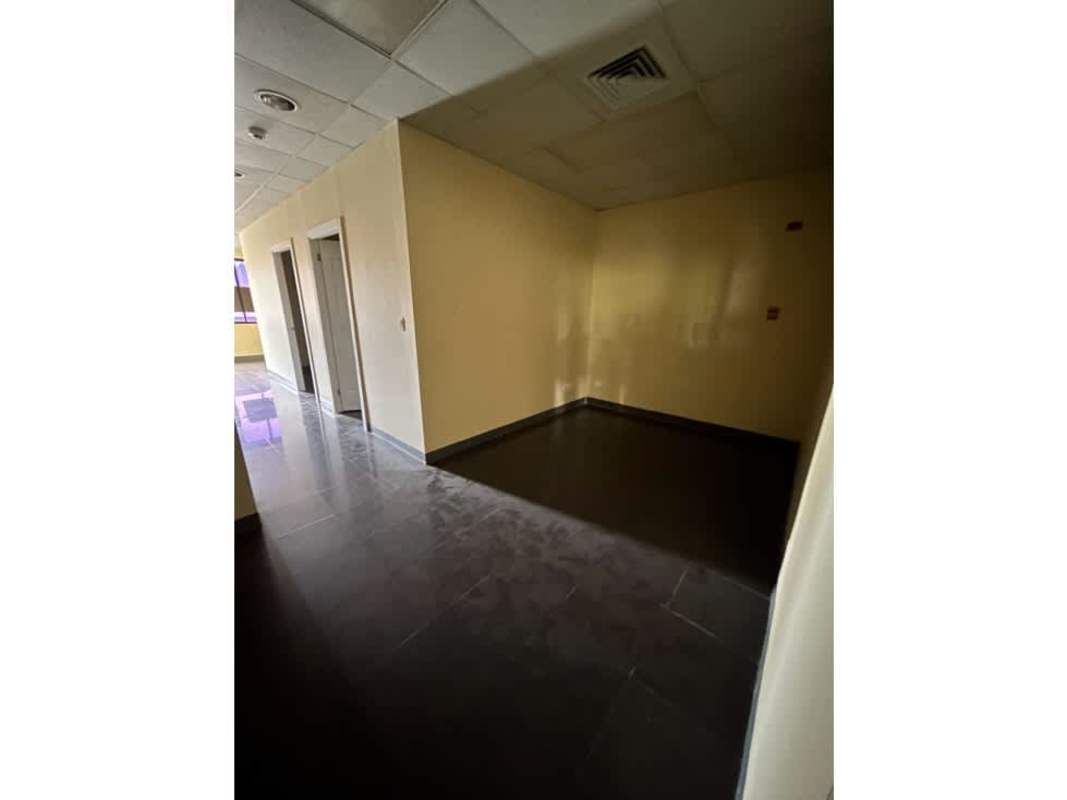 Commercial property hallway with tiled floor and doors inside Panama business center