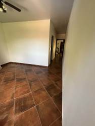 Master bedroom with ceiling fan and balcony mountain views in Altos del María