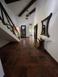 Spacious living room with vaulted ceiling and mountain views in Altos del María