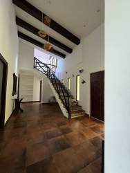 Rustic balcony overlooking private pool and gardens in Altos del María