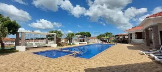 Swimming pool with sun loungers, pergolas shaded area Costa Verde Panama