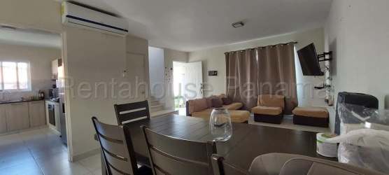 Living area with tile flooring, dining table, staircase to upper floor in Versalles Oeste House Panama