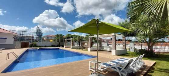 Modern two-story townhouses with palm trees Costa Verde Versalles Oeste La Chorrera Panama