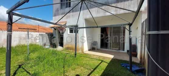 Private backyard with terrace, grass lawn, metal gazebo frame La Chorrera Panama