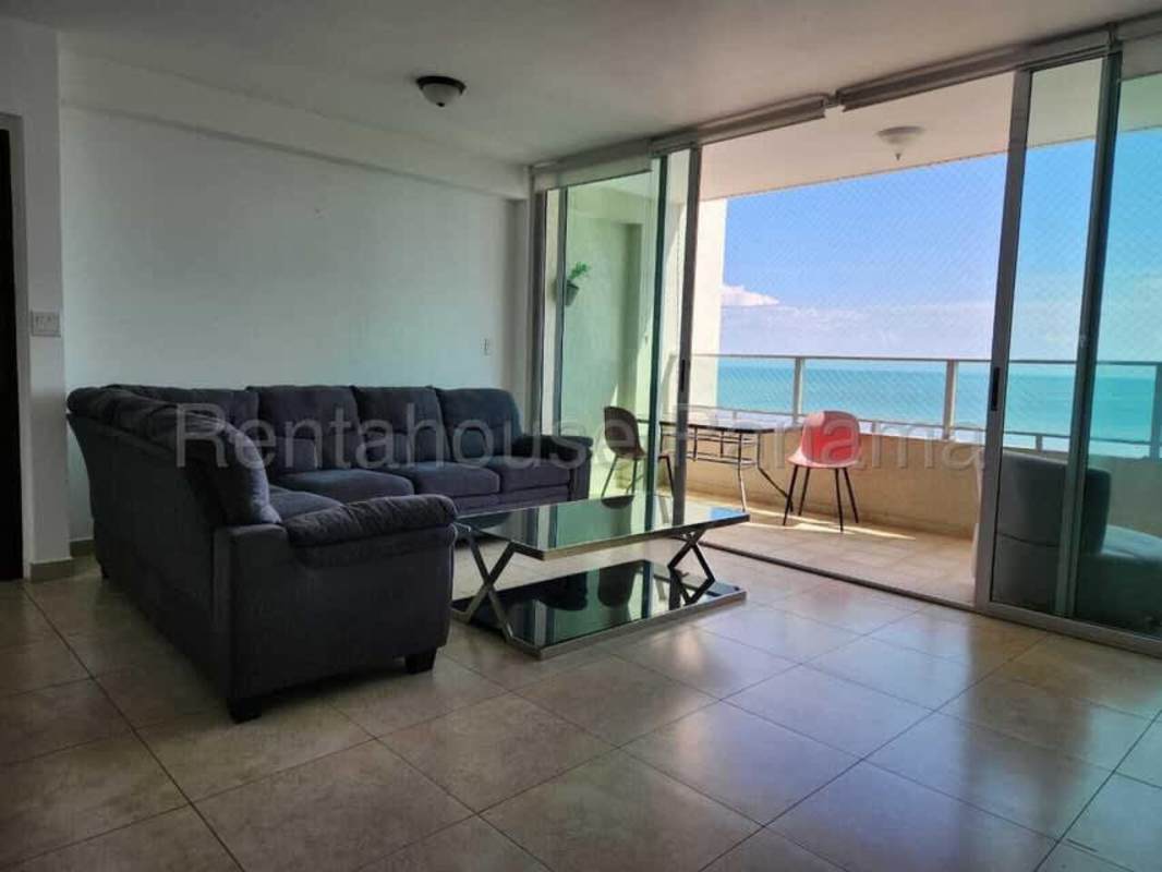 Spacious living area with access to ocean-facing balcony in PH Pacific Sea San Francisco Panama City