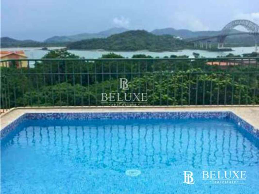 Contemporary kitchen with light wood cabinets and white countertop in PH Amador Hill Amador Panama