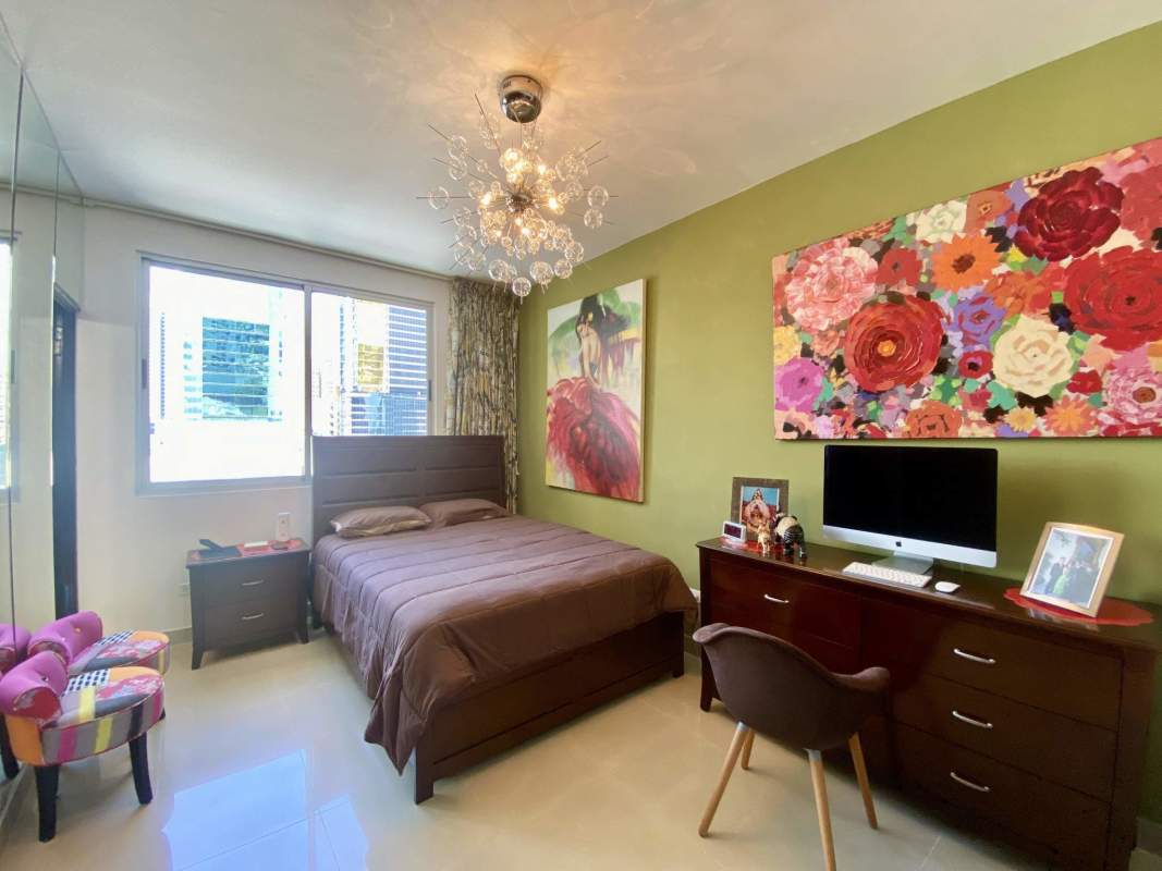 Master bedroom with view, chandelier and decor PH Galeria Uno Obarrio Panama