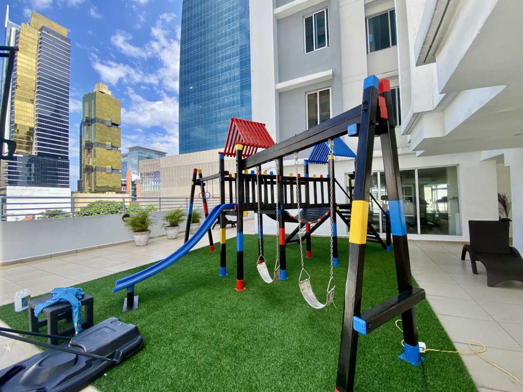 Bedroom with bed and window overlooking skyline PH Galeria Uno Obarrio