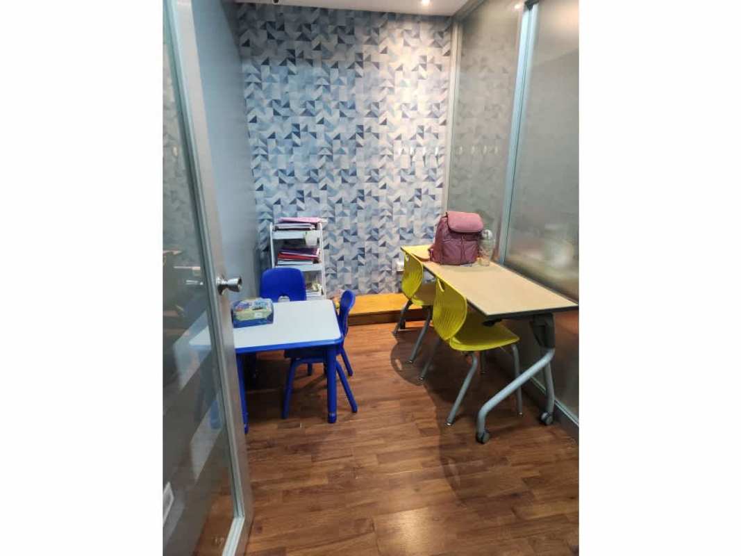 Small private study classroom colorful design glass partitions in commercial center Panama
