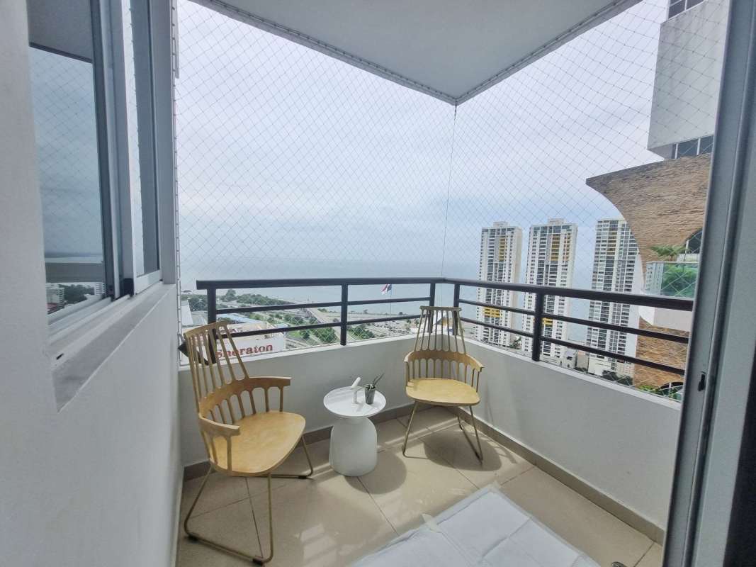 Spacious master bedroom with wood floors large windows ocean skyline view PH Mandarin Bay