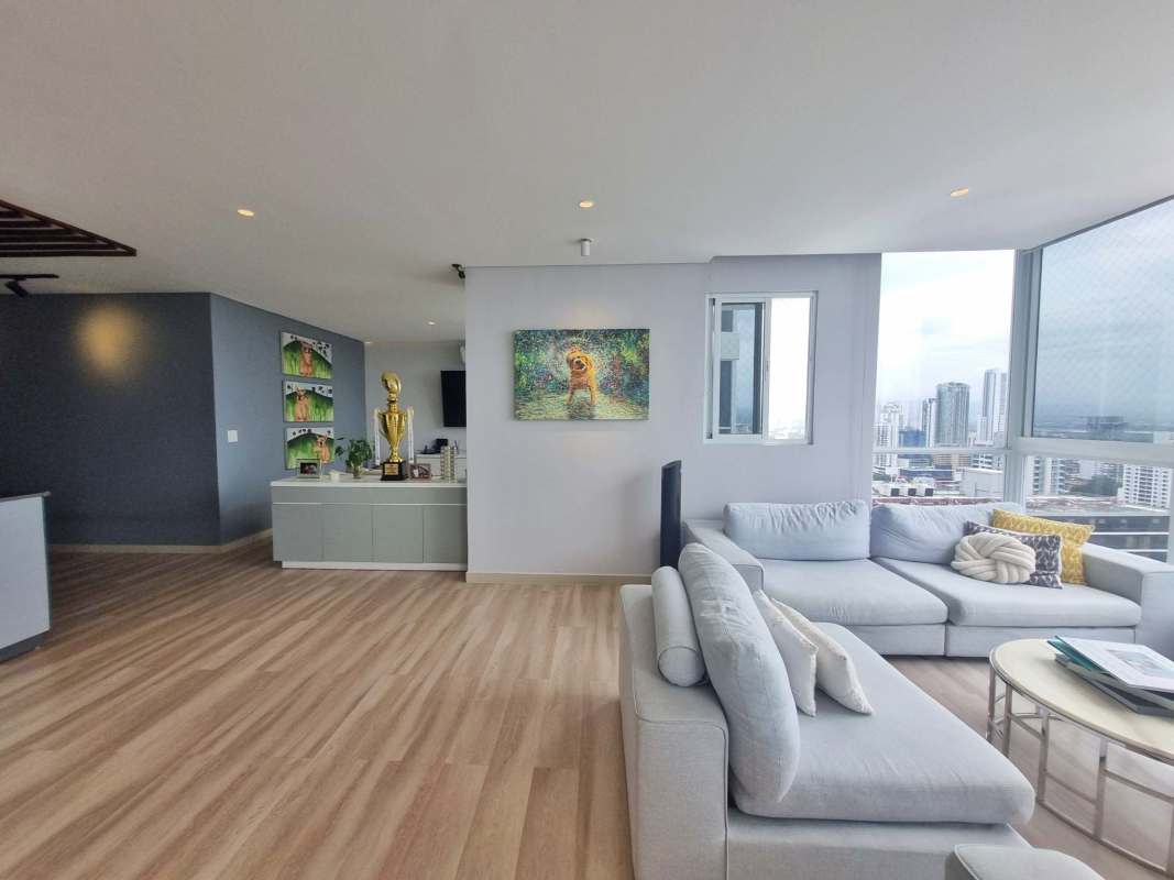 Bright living dining room open plan wood floors large windows ocean view PH Mandarin Bay