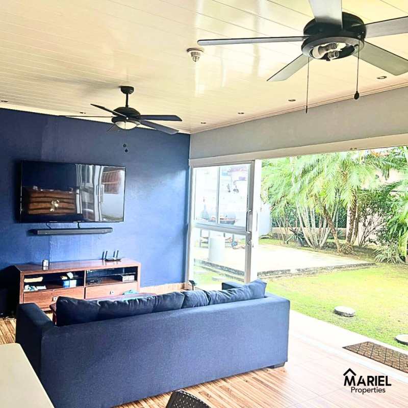 Spacious living room with sliding doors to terrace in PH Lomas del Golf Brisas del Golf Panama City