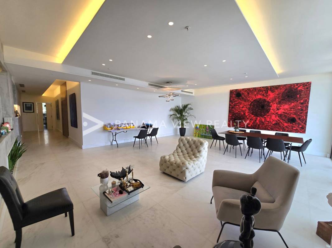 Spacious master suite with floor-to-ceiling windows, ocean view, ensuite bath, marble floors in PH The Residences Panama