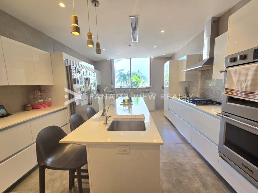 Modern luxury bathroom with marble finish, glass shower, double sinks, bathtub at PH The Residences Panama