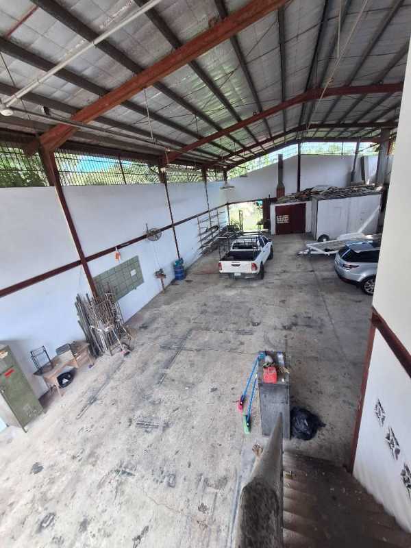 Spacious industrial interior with metal beams, concrete floor and vehicles Ciudad Radial warehouse