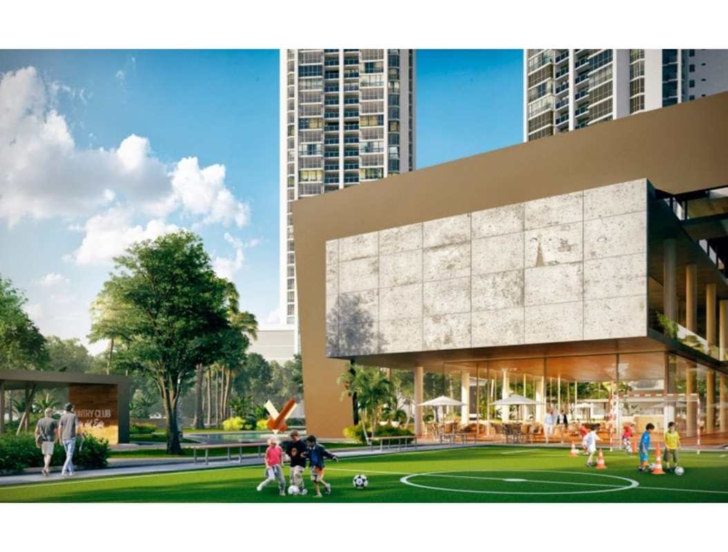 Modern clubhouse complex with playground and sports fields at PH Country Club in Costa del Este Panama