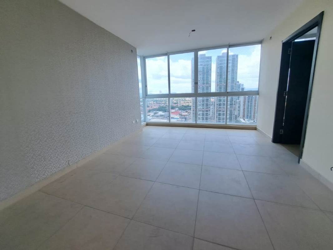 Contemporary living room with large windows and skyline views in PH Country Club Costa del Este