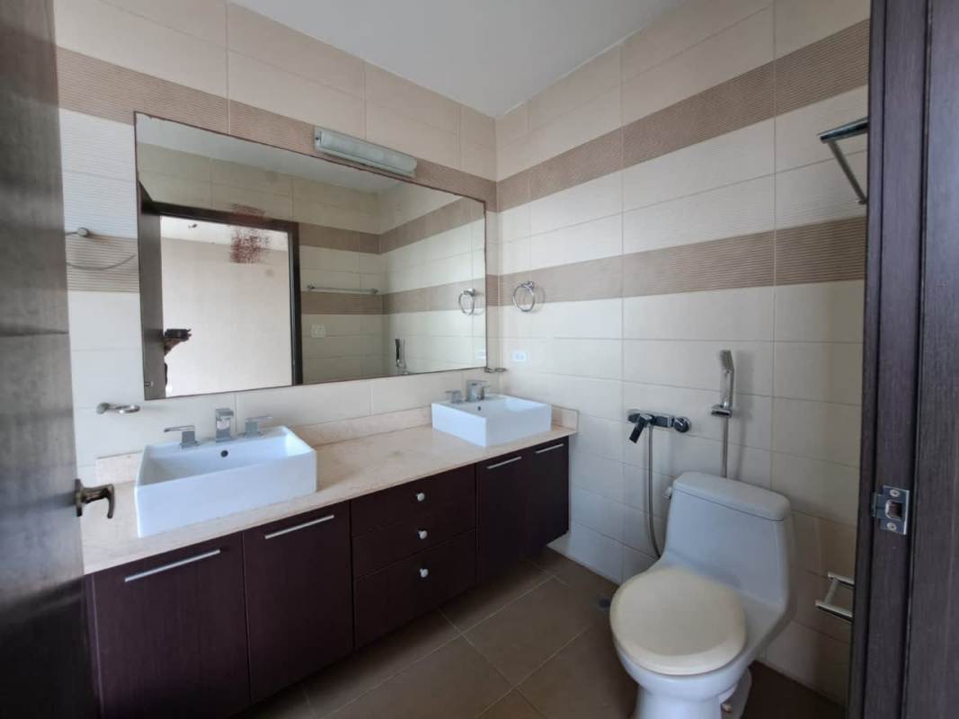 Spacious bathroom with double vanity large mirror and modern fixtures in PH Country Club Costa del Este Panama