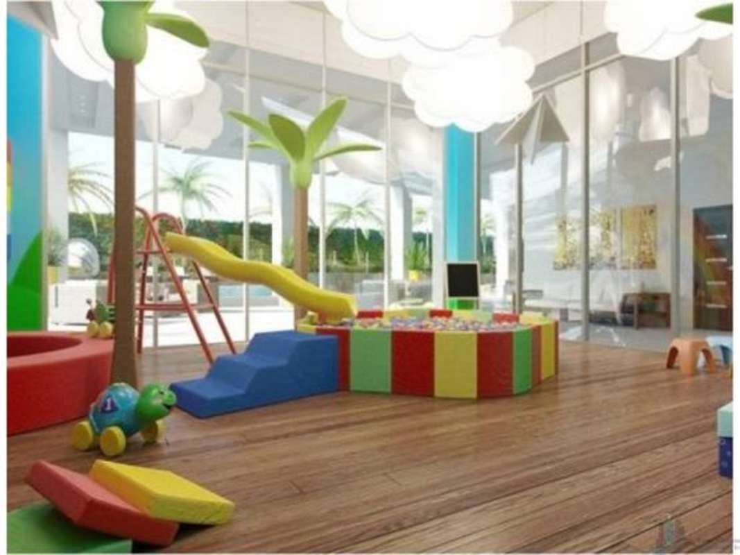 Colorful indoor play room with slide ball pit and creative decor at PH Country Club Costa del Este