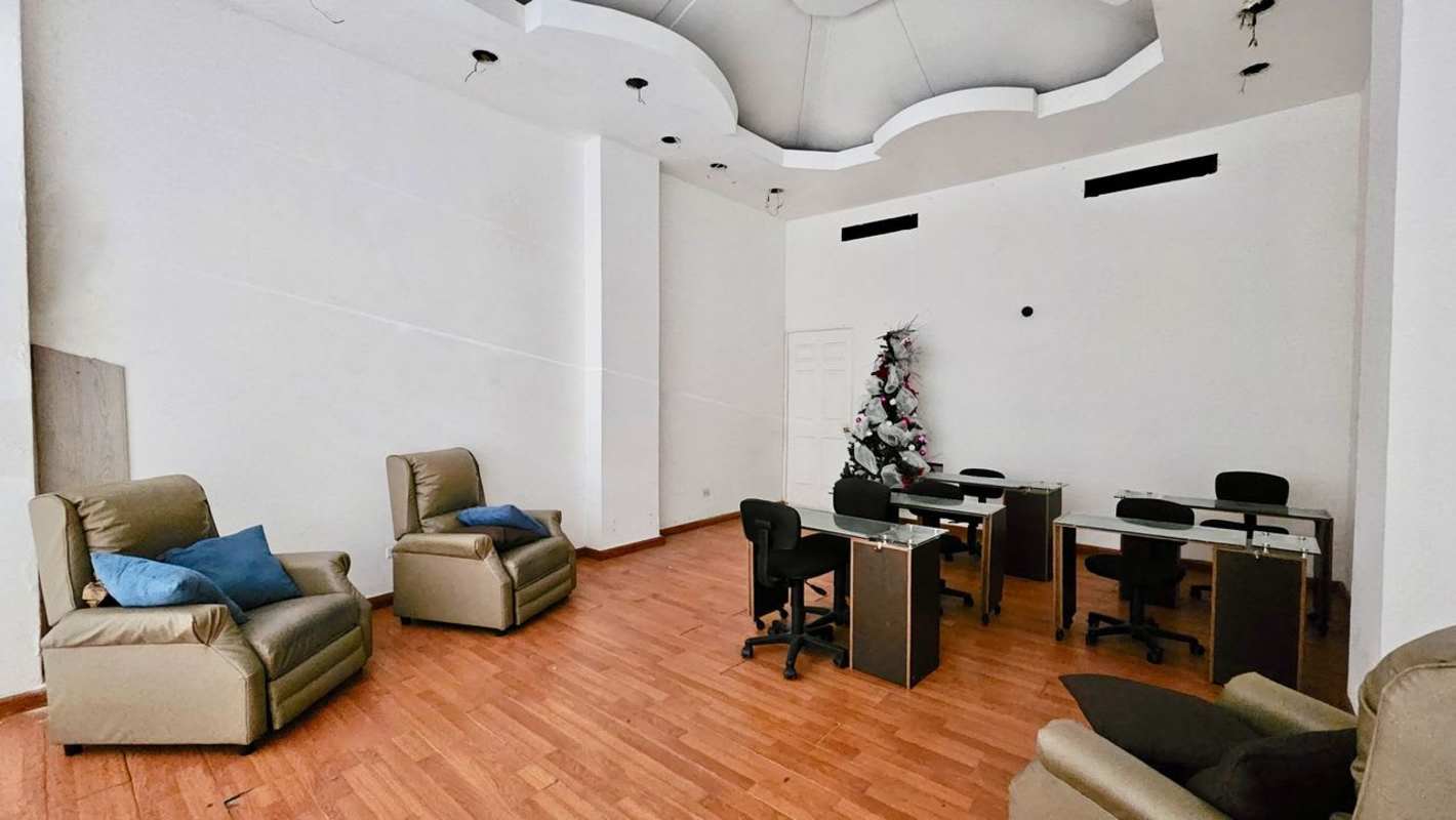 Office style commercial space with recliners glass top desks inside shopping center Panama