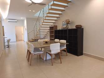 Contemporary kitchen with island and bar seating in beachfront Villa Mar Casamar San Carlos Panama