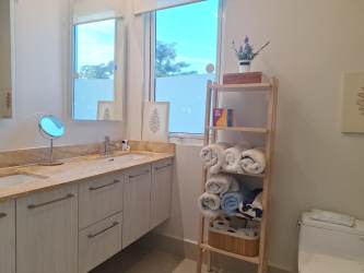 Spacious bedroom with ensuite bath and garden views at Villa Mar Casamar Panama