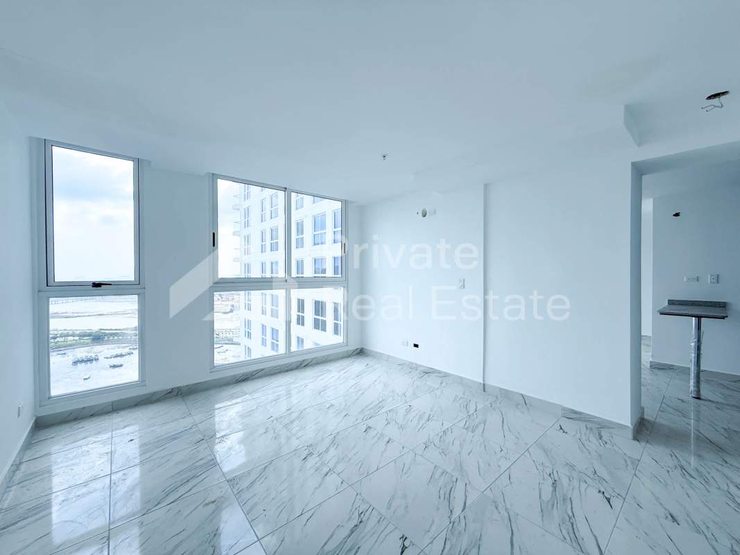 Modern living room with floor-to-ceiling windows and marble tiles in PH The Sands