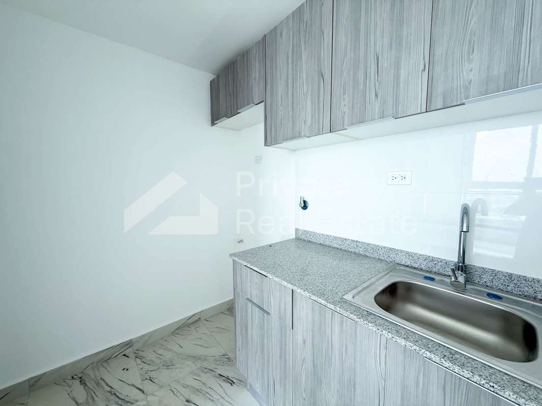 Contemporary kitchen with granite surfaces at PH The Sands Avenida Balboa