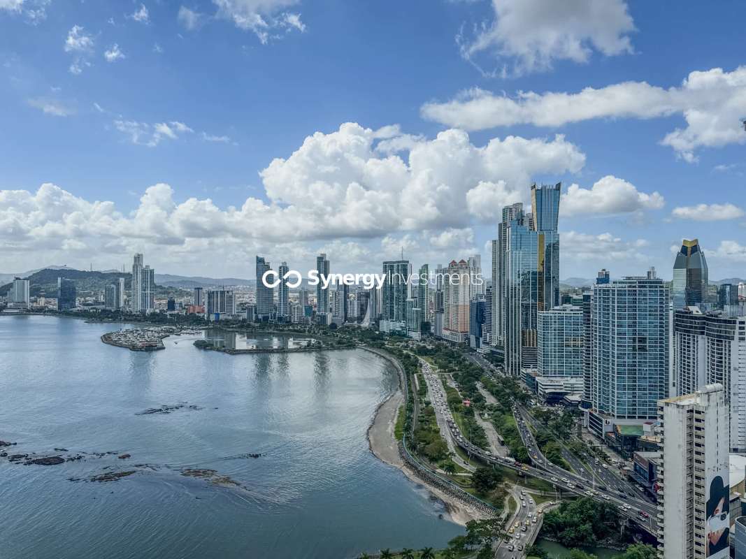 Minimalist kitchen with marble island, built-in appliances at PH Paitilla Tower near Cinta Costera Panama