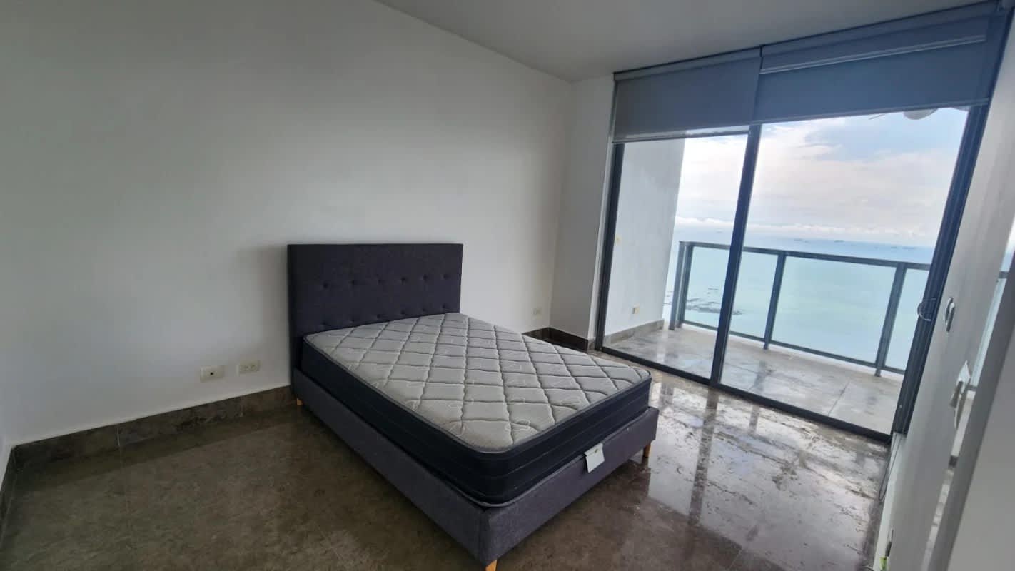 Minimalist bedroom with balcony access to ocean views PH Yoo Panama