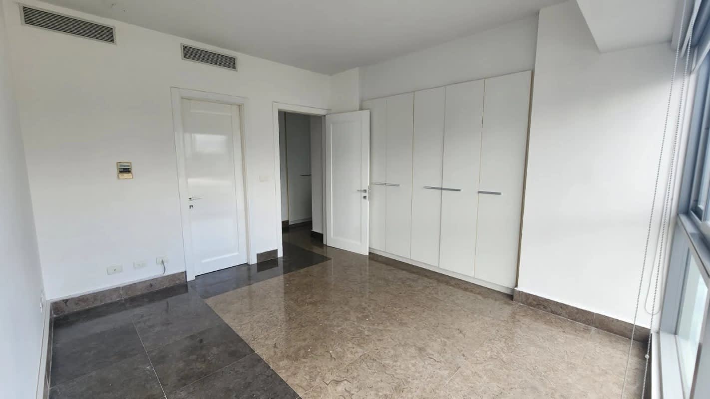 Modern bedroom with large windows city views marble floors PH Yoo Panama