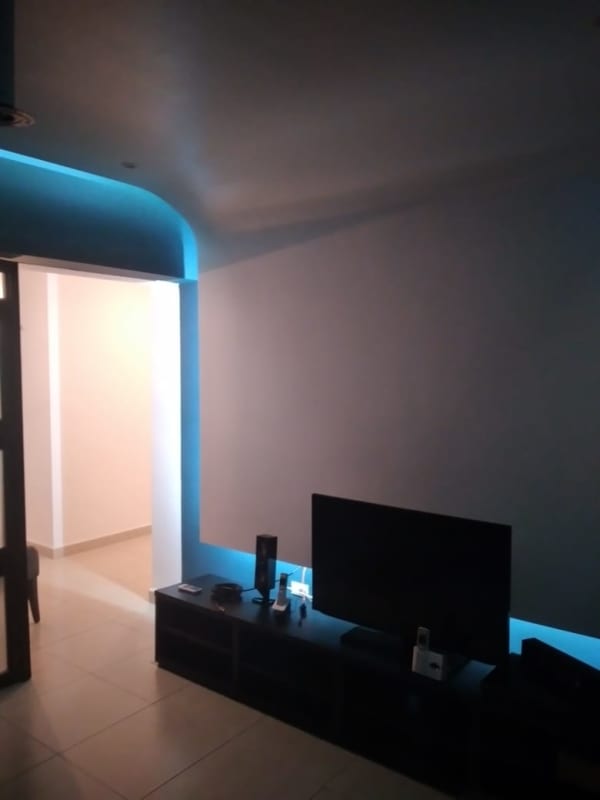 Modern galley kitchen with stainless steel appliances white cabinetry PH Water on the Bay Panama